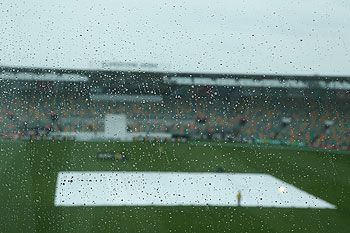A general view is seen of rain drops on a window as rain delays the start of play during day two of the tour match between Australia A and England at the Bellerive Oval in Hobart on Thursday