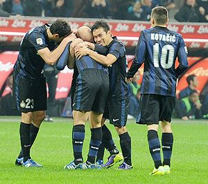 Yuto Nagatomo of FC Inter Milan (centre) celebrates scoring the second goal during the Serie A match against AS Livorno Calcio at San Siro Stadium in Milan on Saturday 