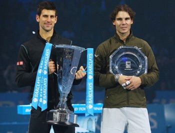 Champion Novak Djokovic (L) of Serbia and Rafael Nadal of Spain pose with their trophies after their men's singles final
