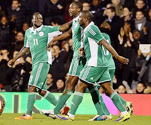 Shola Ameobi of Nigeria (C) celebrates scoring the second goal during the international friendly match between Italy and Nigeria at Craven Cottage in London on Monday