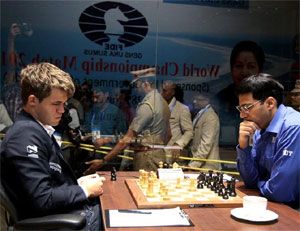 Magnus Carlsen and V Anand plan their next move at the World Chess Championship in Chennai on Tuesday