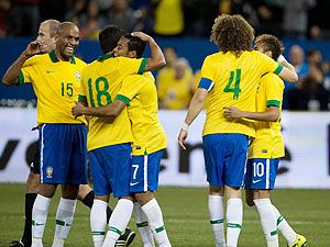 Brazil forward Robinho celebrates scoring a goal with Brazil midfielder Paulinho (18) during the second half in a friendly match against Chile at Rogers Centre in Ontario, Canada