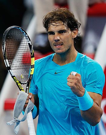 Rafael Nadal of Spain celebrates after defeating Santiago Giraldo of Colombia in the first round of the 2013 China Open
