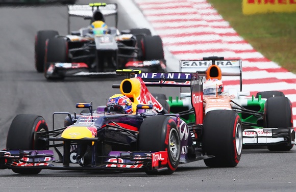 Mark Webber of Infiniti Red Bull Racing followed by Ardian Sutil of Sahara Force India