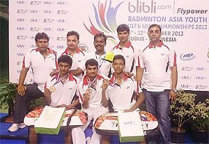 The winning Indian badminton team with their medals