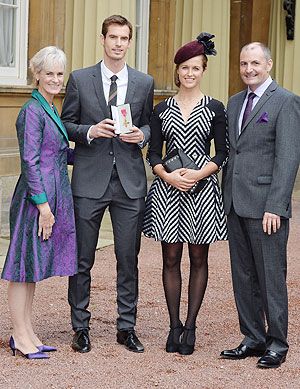 Wimbledon champion Andy Murray, his parents Judy and Will and his girlfriend Kim Sears pose at Buckingham Palace after being awarded the Order of the British Empire (OBE) from Prince William, Duke of Cambridge. on Thursday