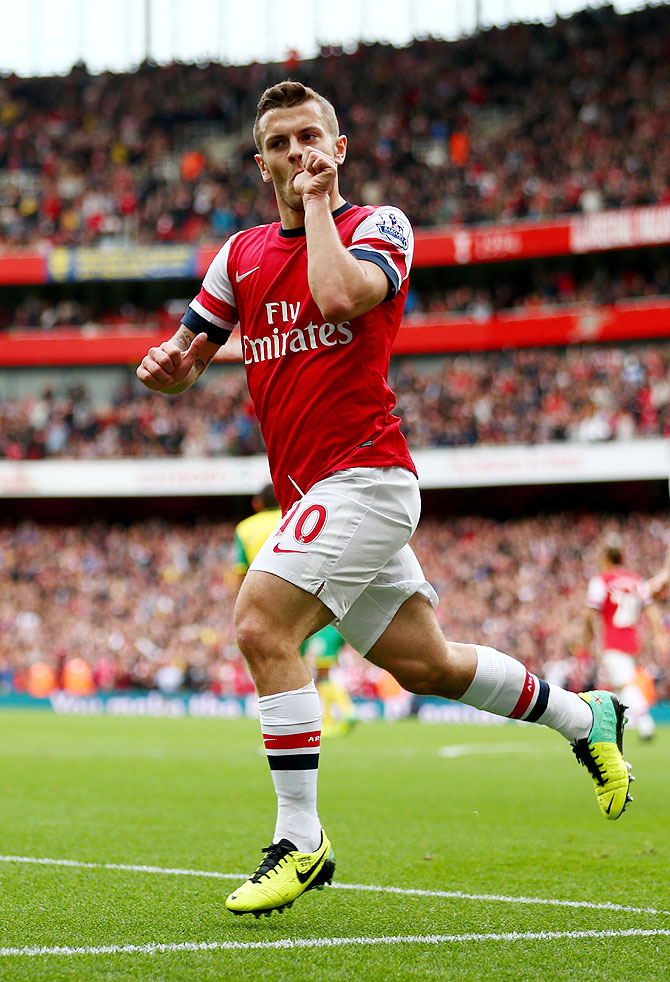 Jack Wilshere of Arsenal celebrates as he scores their first goal against Norwich City at Emirates Stadium on Saturday