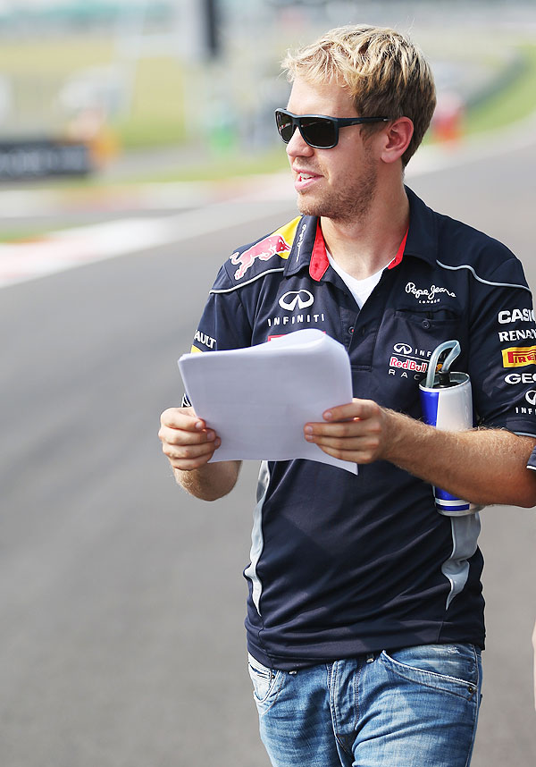 Sebastian Vettel of Germany and Red Bull Racing does a track walk during previews for the Indian Formula One Grand Prix at Buddh International Circuit on Thursday