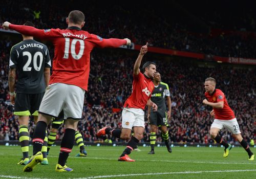 Robin van Persie celebrates after scoring for Manchester United