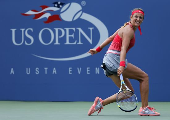 Victoria Azarenka of Belarus checks a shot to Alize Cornet of France at the U.S. Open