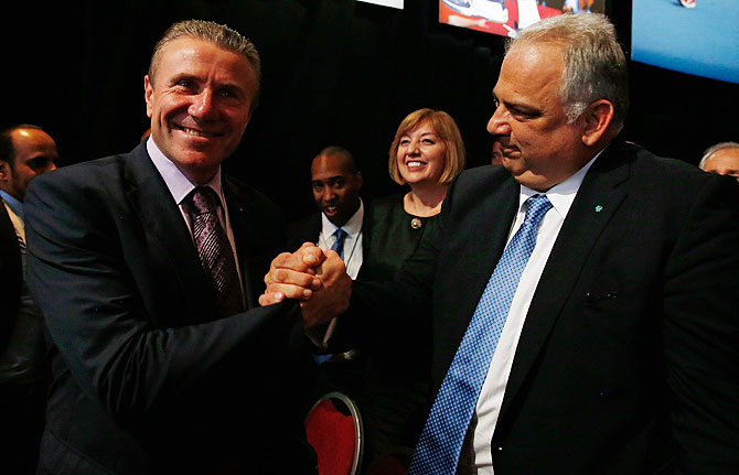 FILA Interim President Nenad Lalovic is congratulated by IOC Executive Committee Member   Sergey Bubka as wrestling is voted to be included in the 2020 Summer Olympic Games during   the 125th IOC Session in Buenos Aires, Argentina, on Sunday