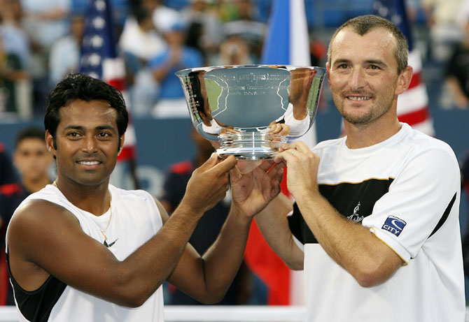 Martin Damm of the Czech Republic and Leander Paes (left) pose with their US Open trophy
