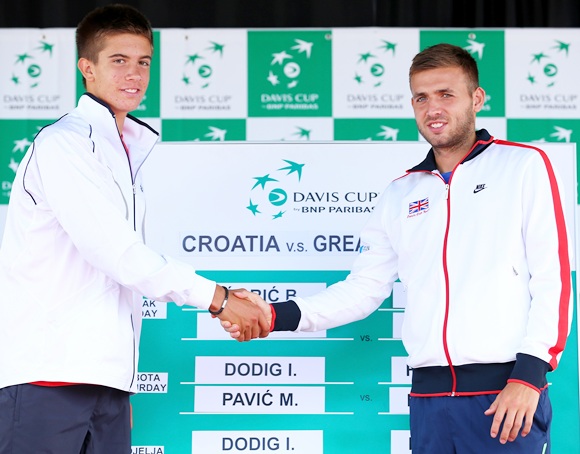 Daniel Evans of Great Britain shakes hands with second day opponent Borna Coric of Croatia