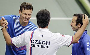 Czech Republic's Radek Stepanek (right) and Tomas Berdych (left) are congratulated by team captain Jaroslav Navratil after defeating Argentina's Horacio Zeballos and Carlos Berlocq during their Davis Cup semi-final doubles match in Prague on Saturday
