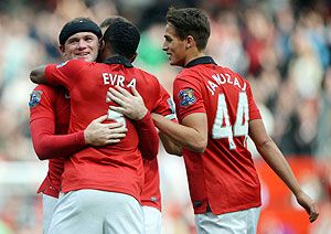 Wayne Rooney of Manchester United is congratulated by Patrice Evra and Adnan Januzaj (44) after scoreing against Crystal Palace at Old Trafford on Saturday