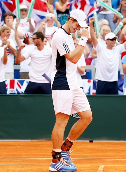 Andy Murray of Great Britain celebrates winning against Ivan Dodig of Croatia