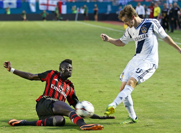 Mbaye Niang (78) of AC Milan dives for the ball against Sean Franklin (5) of Los Angeles Galaxy