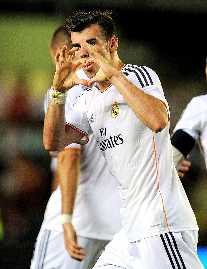 Gareth Bale celebrates after scoring a goal