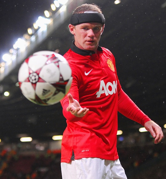 Wayne Rooney of Manchester United looks on