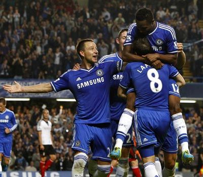 Chelsea players celebrate after John Obi Mikel scored the second goal against Fulham