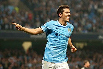 Stevan Jovetic of Manchester City celebrates after scoring the fourth goal during the Capital One Cup third round match against Wigan Athletic at Etihad Stadium in Manchester on Tuesday