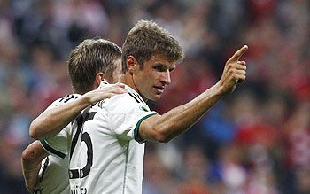 Bayern Munich's Thomas Mueller (right) and Toni Kroos celebrate a goal during their second round German soccer cup (DFB-Pokal) match against Hanover 96 in Munich on Wednesday
