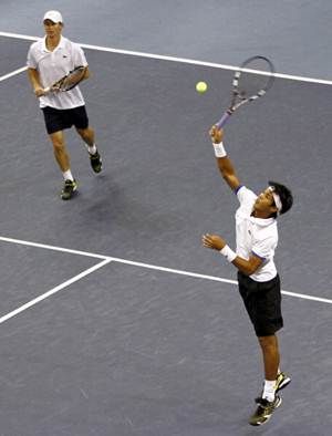  Rik De Voest of South Africa and Somdev Devvarman of India in action during day four of the 2013 Malaysian Open