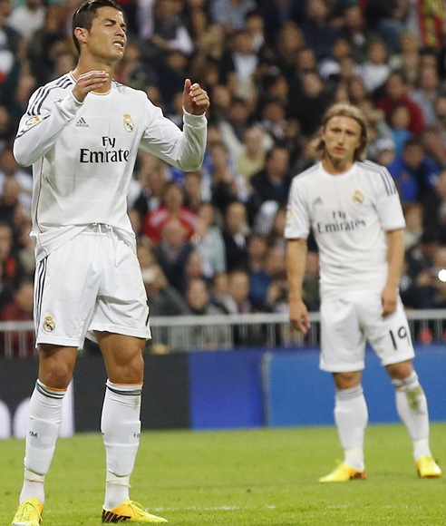 Real Madrid's Cristiano Ronaldo (left) reacts