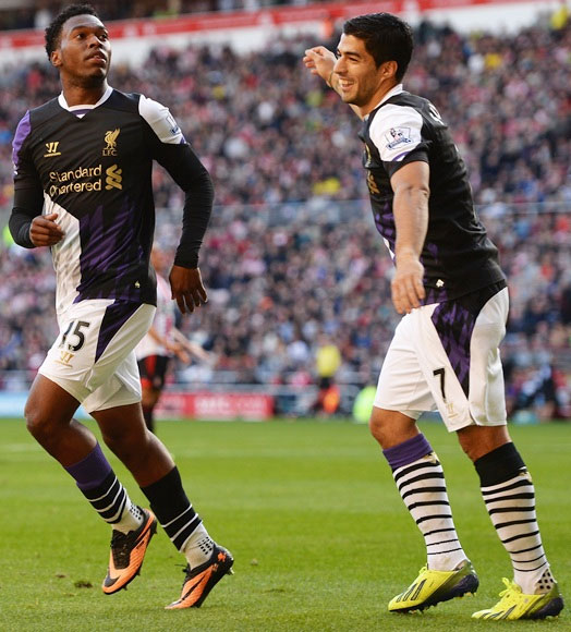 Daniel Sturridge (left) of Liverpool celebrates scoring the opening goal with Luis Suarez