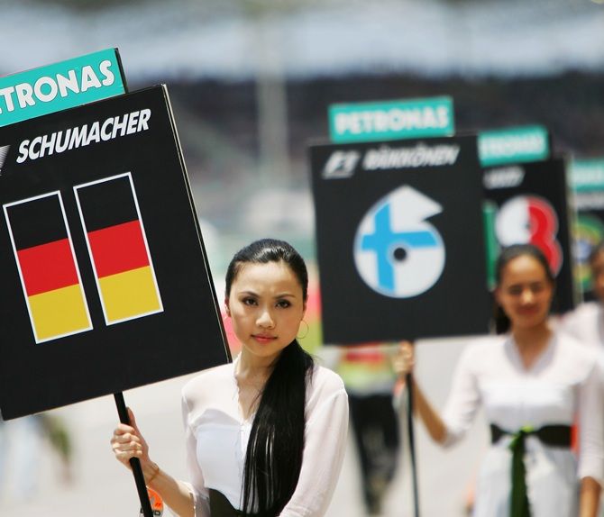 A grid girl holds the name of Ralf Schumacher of Germany and Toyota before the start of the Malaysian Formula One Grand Prix at the Sepang Circuit on April 8, 2007