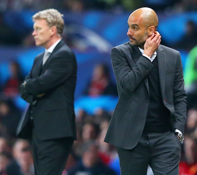 Pep Guardiola head coach of Bayern Muenchen scratches his head