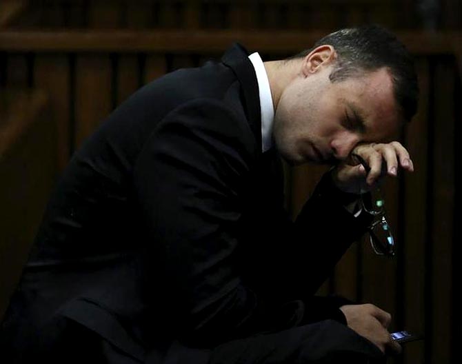 Oscar Pistorius breaks down during his trial at the high court in Pretoria