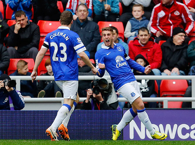 Gerard Deulofeu (right) of Everton celebrates his team's goal with teammate Seamus Coleman during their English Premier League match against Sunderland at the Stadium of Light in Sunderlandon Saturday