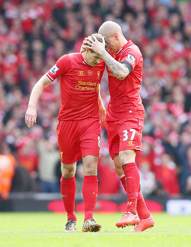 Martin Skrtel of Liverpool celebrates scoring the second goal with teammate Steven Gerrard (left) during the English Premier League match against Manchester City at Anfield on Sunday