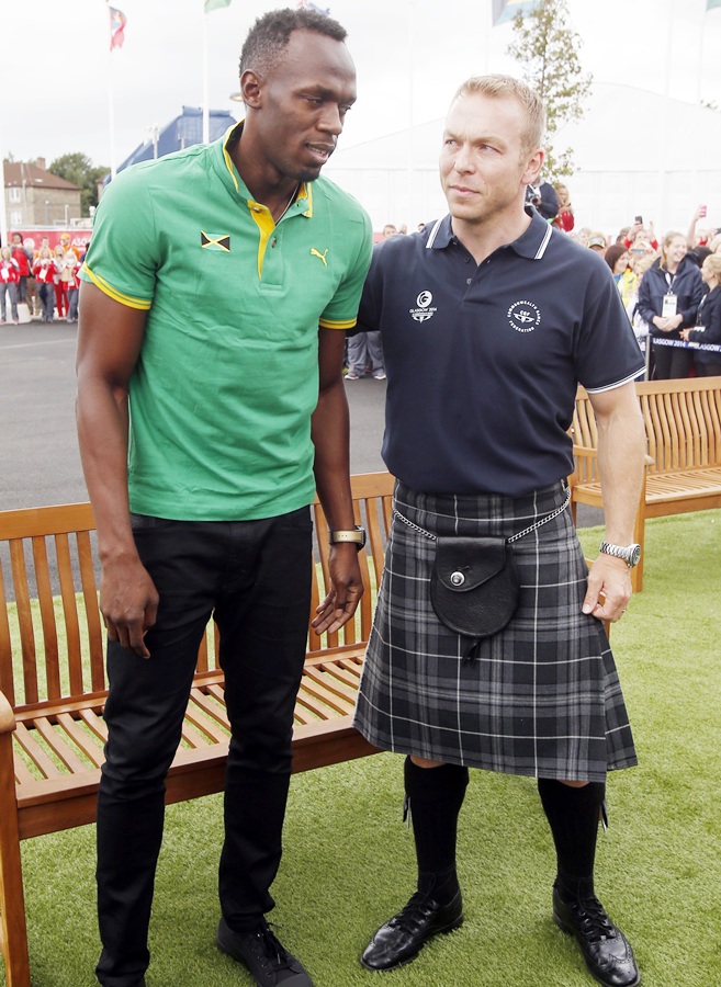 Sir Chris Hoy meets Usain Bolt during a visit to the Commonwealth Games Village