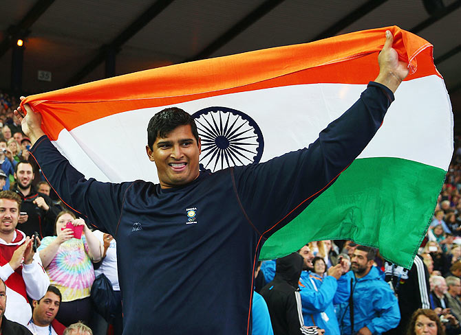 Vikas Shive Gowda of India celebrates winning gold in the Men's Discus Final at Hampden Park during day eight of the Glasgow 2014 Commonwealth Games on Thursday