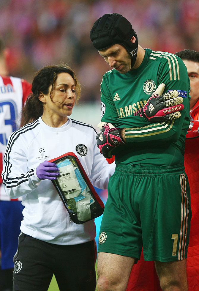Petr Cech walks off the pitch after being injured