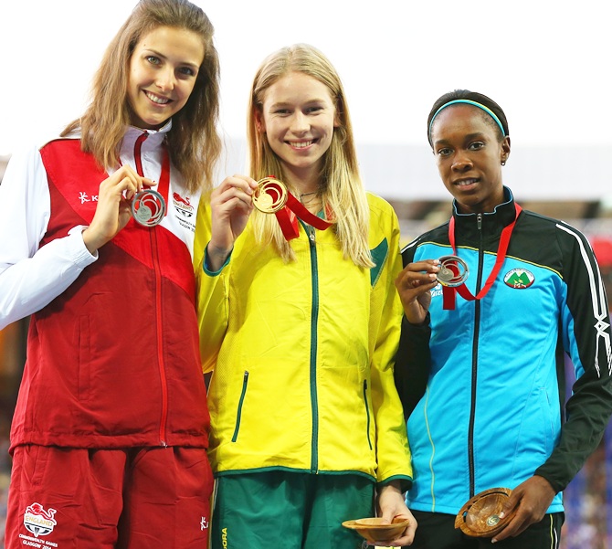 From left, Silver medallist Isobel Pooley of England, gold medallist Eleanor Patterson of Australia and bronze medallist Levern Spencer of Saint Lucia pose on the podium during the medal ceremony for the Womens High Jump at Hampden Park