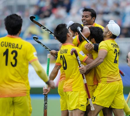 India's hockey players celebrate winning their match against New Zealand
