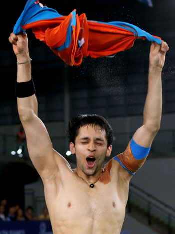 Parupalli Kashyap of India celebrates winning gold