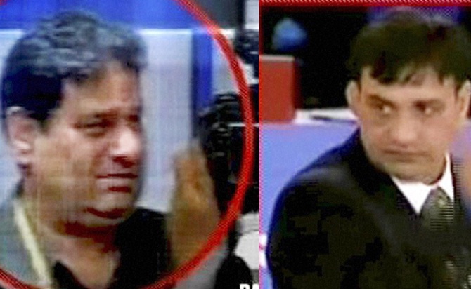 TV grab of Indian officials Rajeev Mehta (left) and Virender Malik