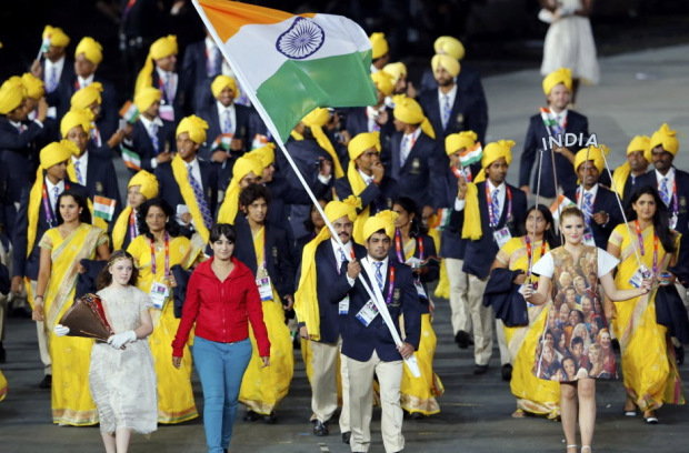 An unidentified woman walks with the Indian contingent at the London Olympics