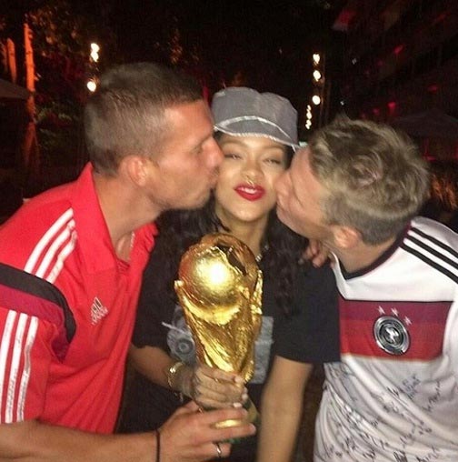 (Left to right): Lucas Podolski, Rihanna and Bastian Schweinsteiger revel after Germany's World Cup win