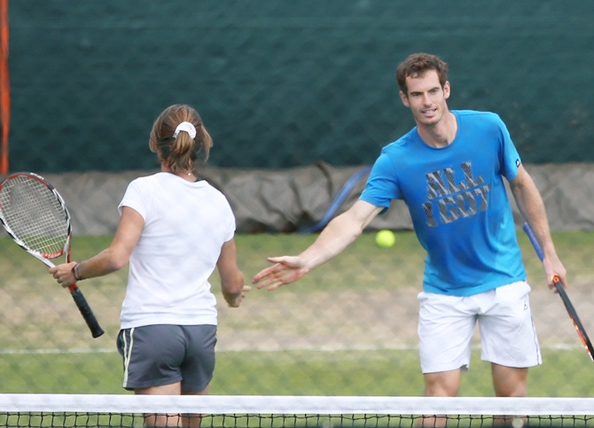 Andy Murray of Great Britain shakes hands with his coach Amelie Mauresmo