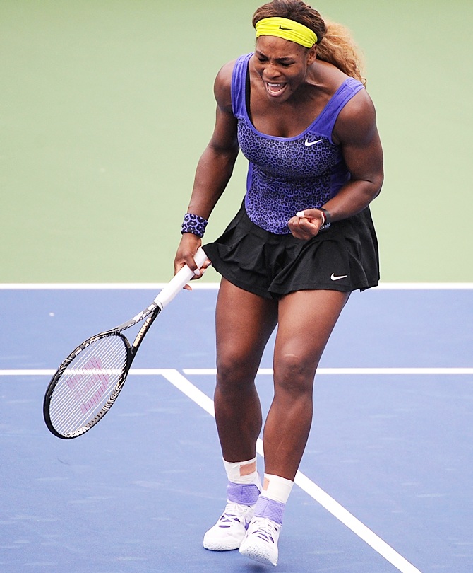 Serena Williams reacts during a match against Caroline Wozniacki of Denmark