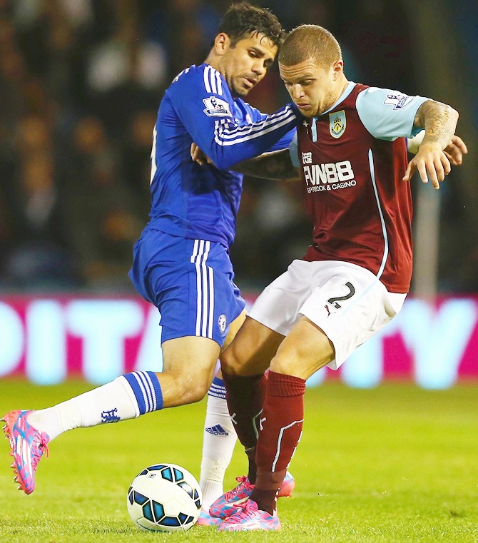 Diego Costa of Chelsea and Kieran Trippier of Burnley battle for the ball