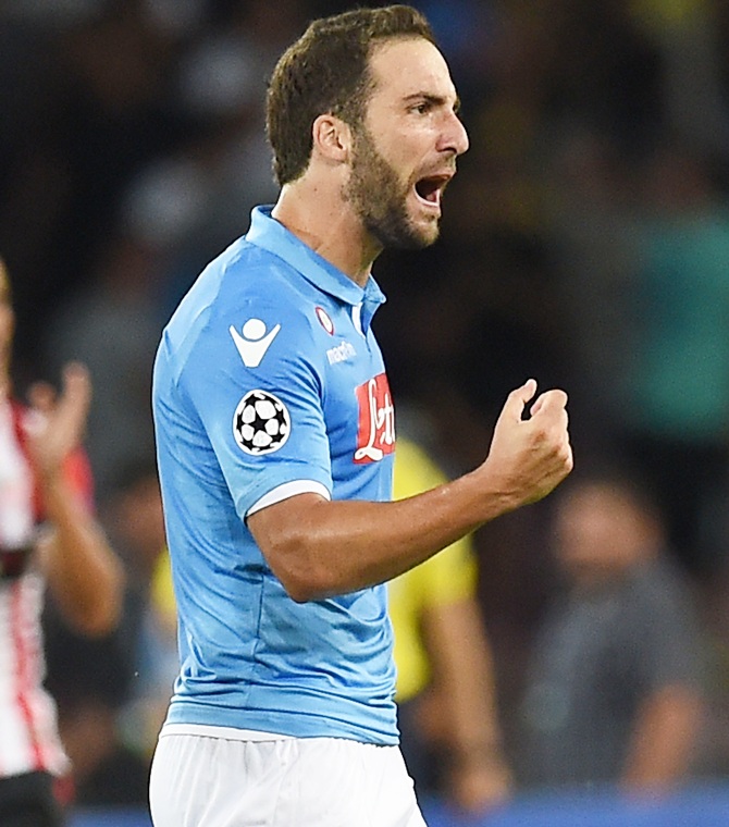Gonzalo Higuain of Napoli celebrates after scorig the goal during the first leg of   UEFA Champions League qualifying play-offs round match against Athletic Club