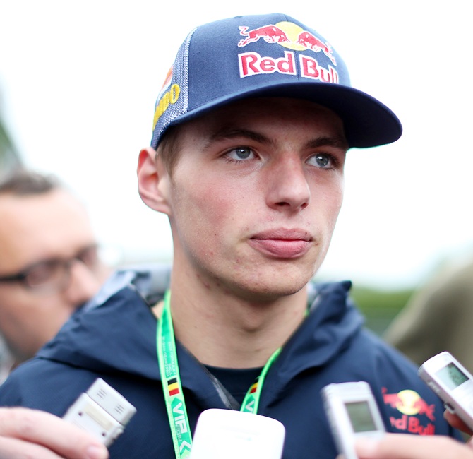 Max Verstappen, who is set to replace Jean-Eric Vergne of France at Scuderia Toro Rosso   next season, speaks with members of the media in the paddock