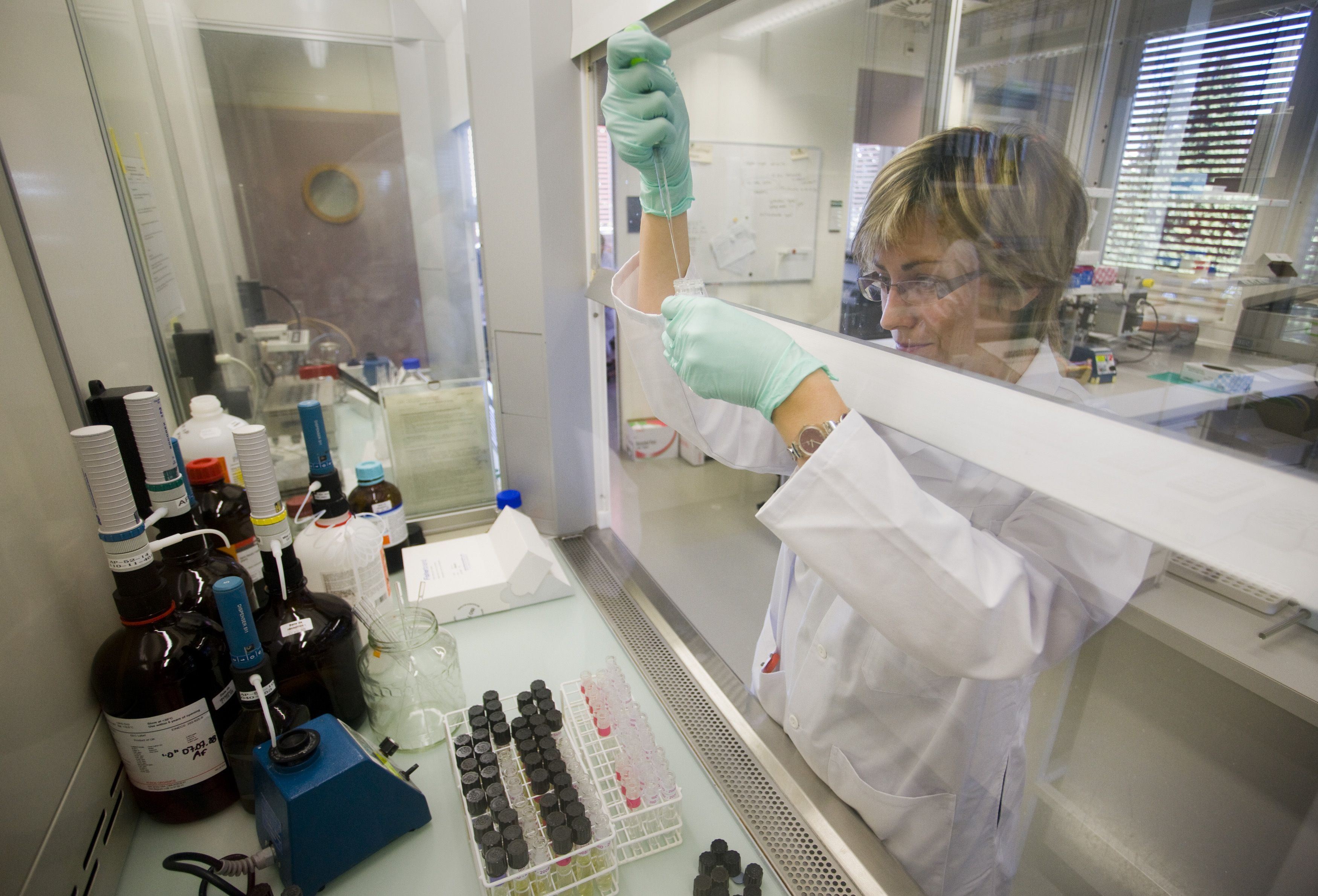 A technician prepares urine sample for testing at the Swiss Laboratory for Doping Analysis