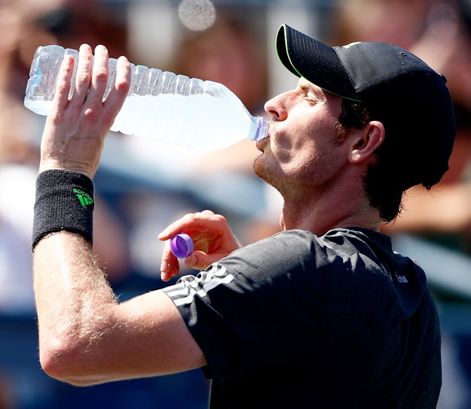 Andy Murray of Great Britain drinks during a break against Robin Haase of the Netherlands